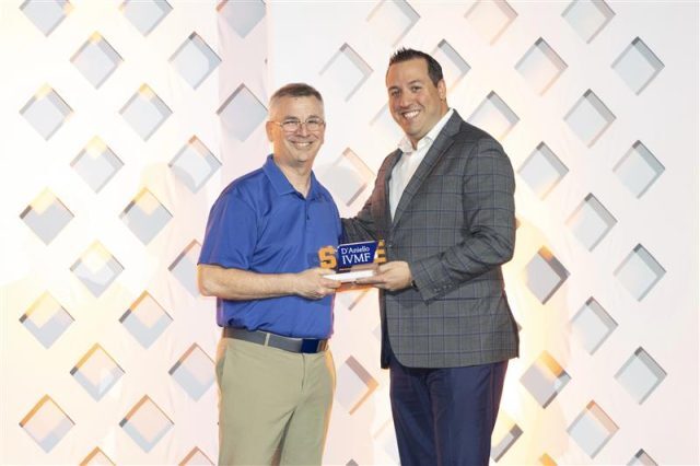 Rod Loges, Founder and CEO of One Degree Financial, accepts the Capital Catalyst Award at the 2026 IVMF Ambassador Impact Awards ceremony.